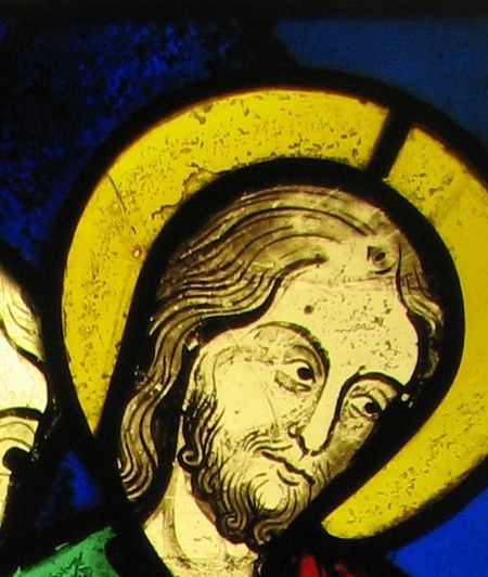 The radiant halo signifies his sanctity and divine connection.