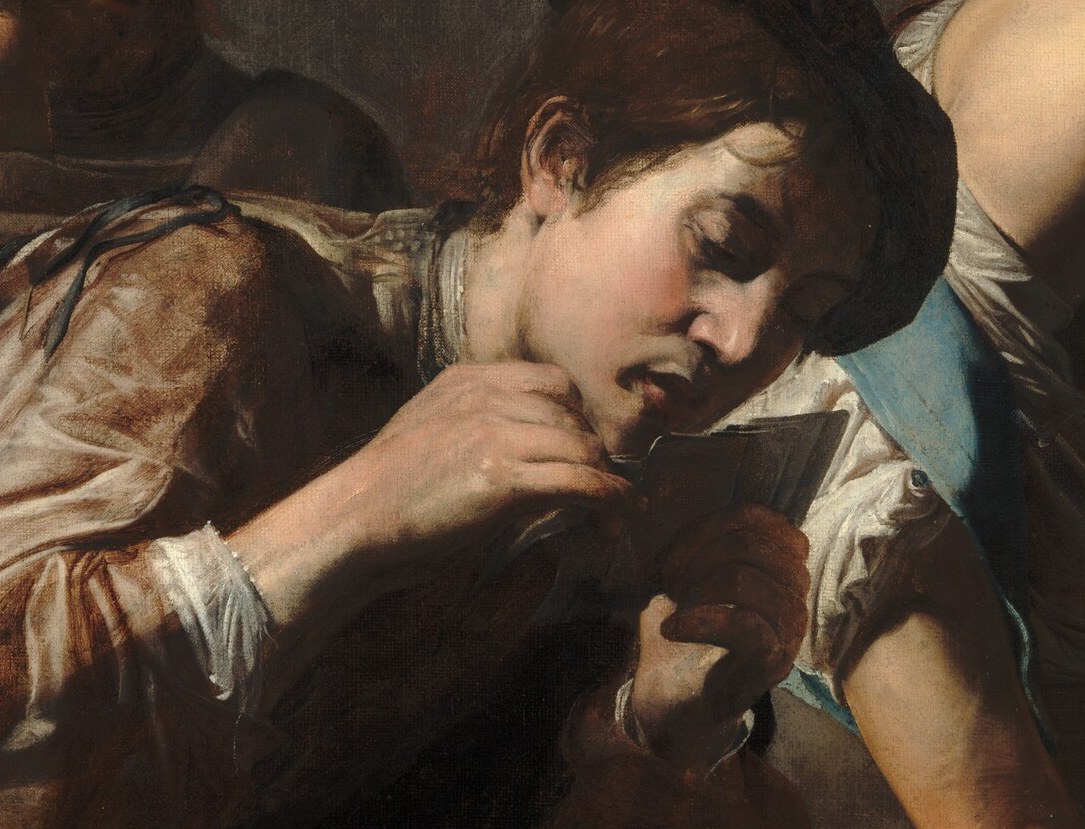 His intense, downward gaze and furrowed brow suggest concentration and perhaps a hint of deceit.