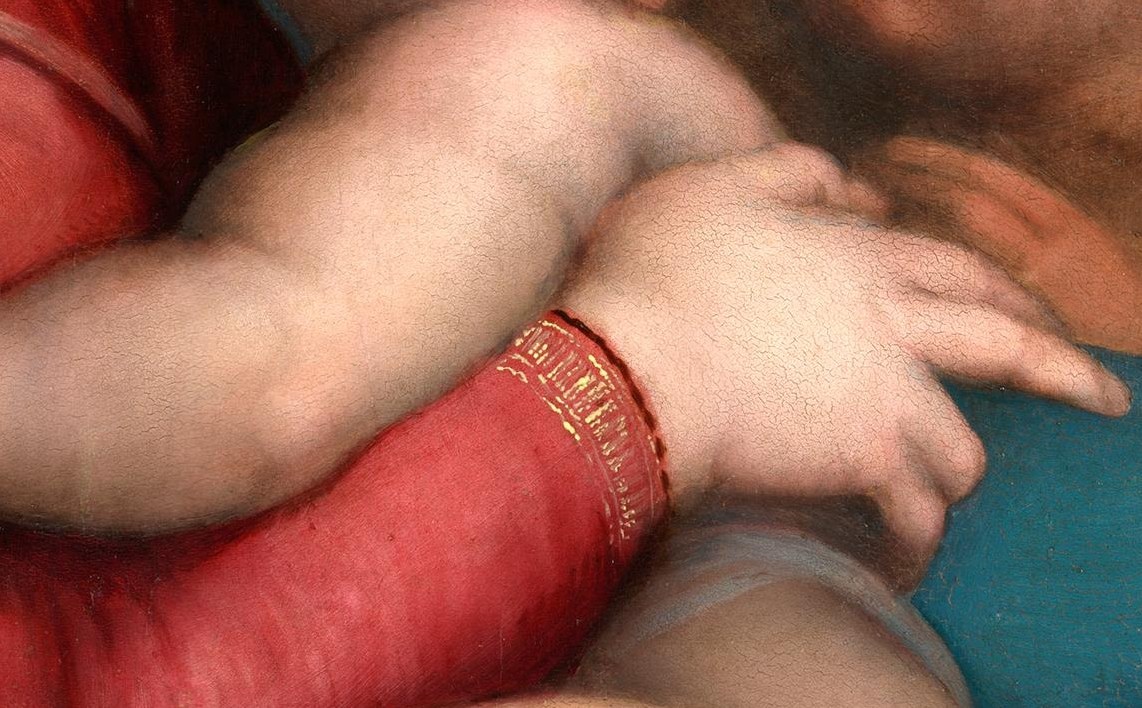 Mary cradles the Christ Child tenderly.