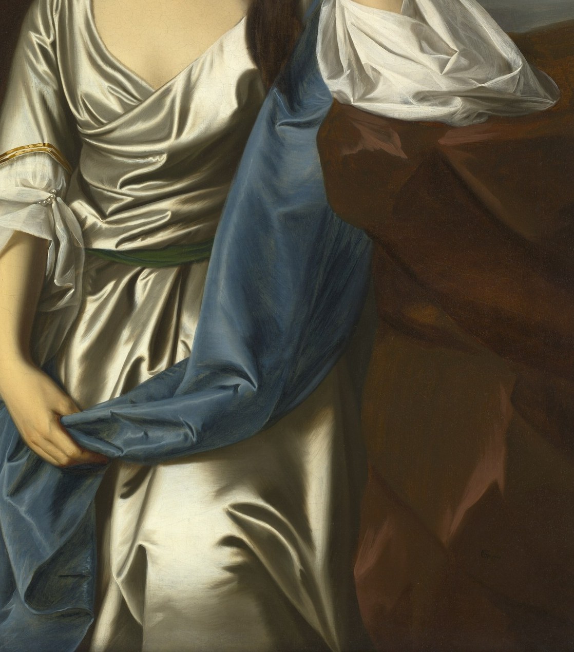 Notice the shimmering satin dress.