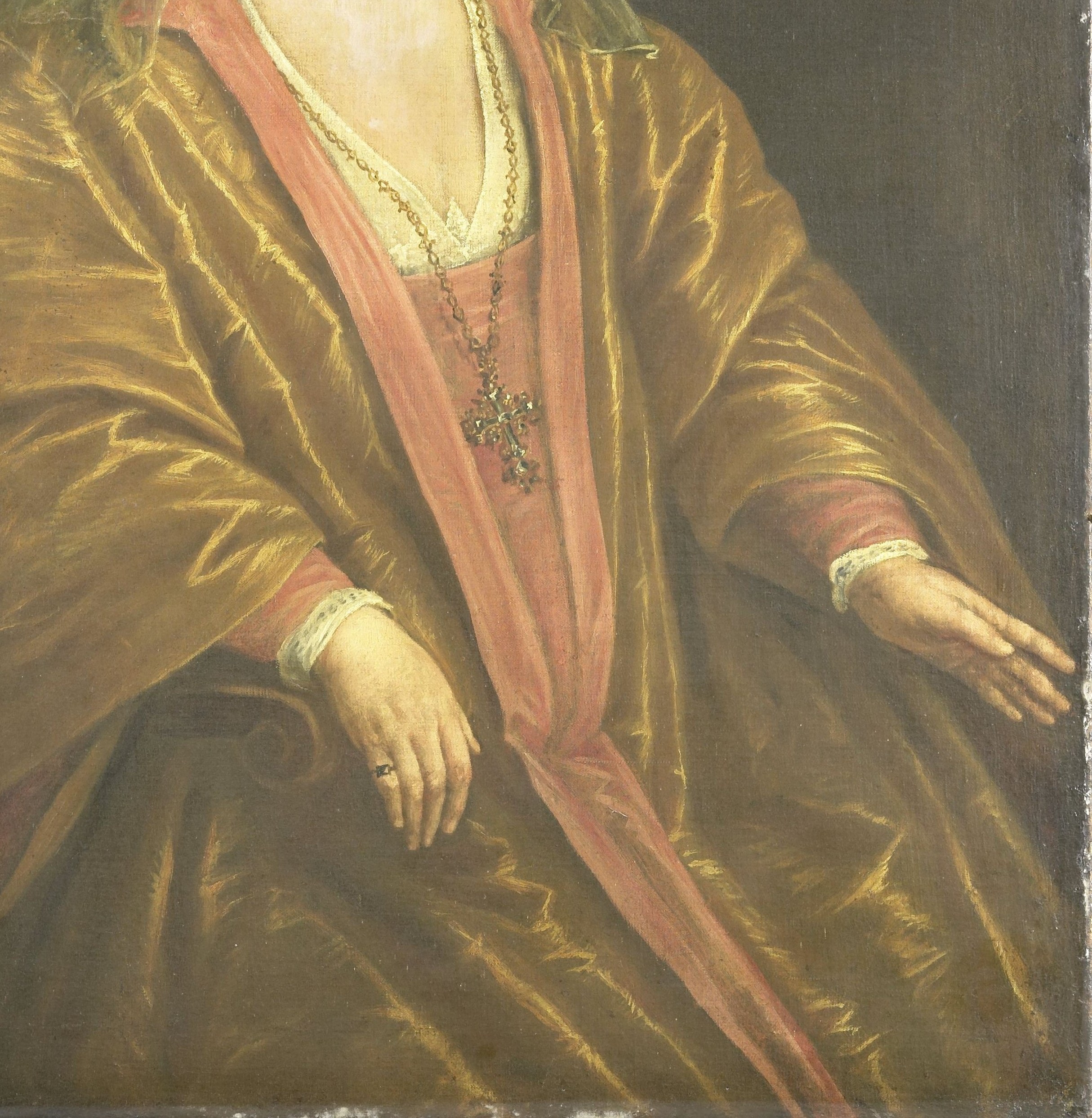 Her luxurious dress and jewels speak of her status.