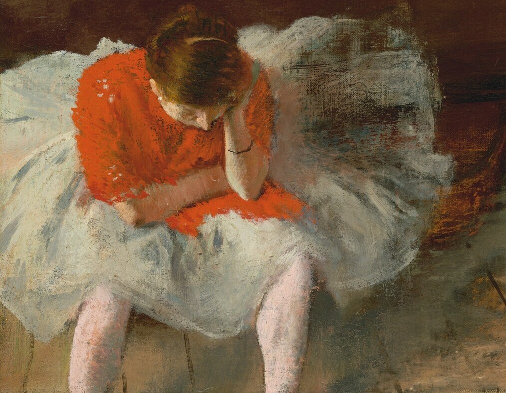 Her posture suggests exhaustion or despair, a poignant contrast to the expected grace of a dancer.