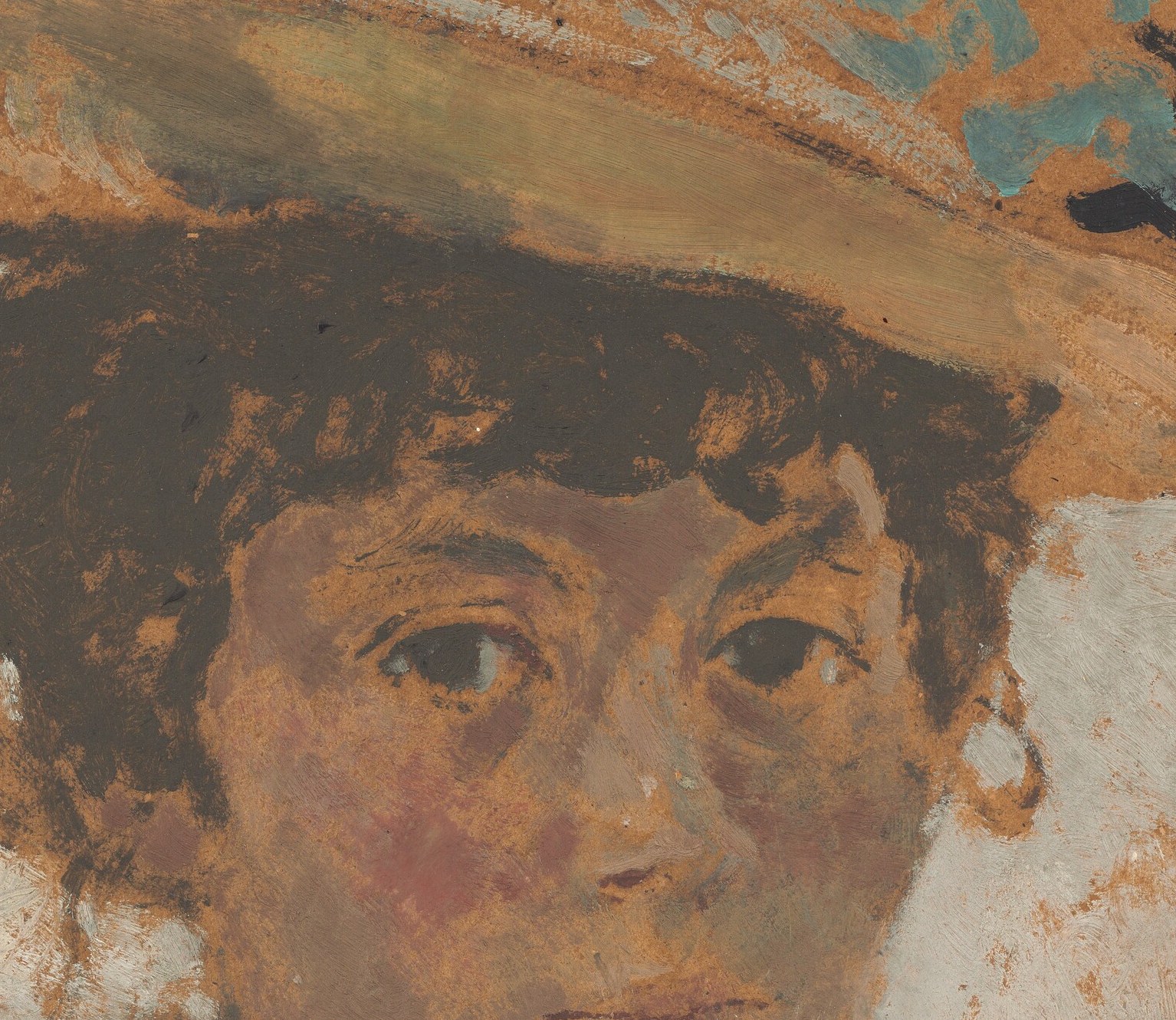 The brim and her skin share the same warm ochre.