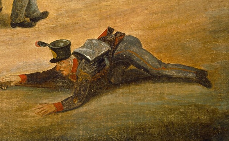 Near the red carriage, a man lies fallen, clutching his firearm.