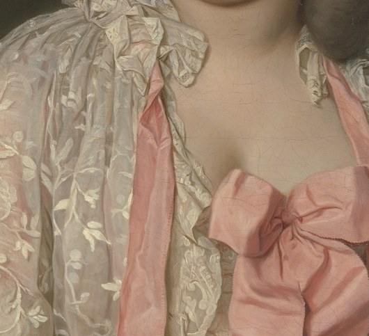 The single most vivid chromatic accent in the painting; the saturated rose bow signals fashionable excess on the eve of the Revolution and anchors every viewer's eye