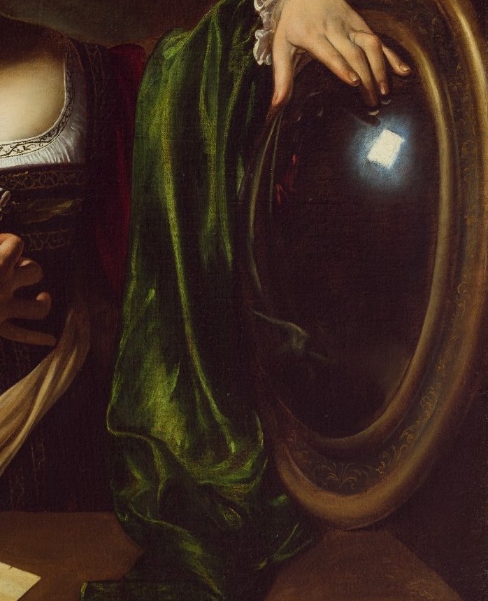 This mirror reflects the worldly life she considers leaving behind.