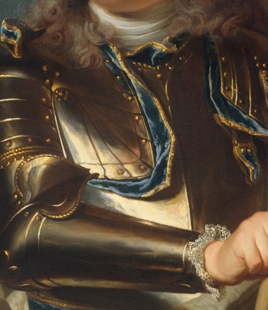 Look closely at the blue ribbon across his chest.
