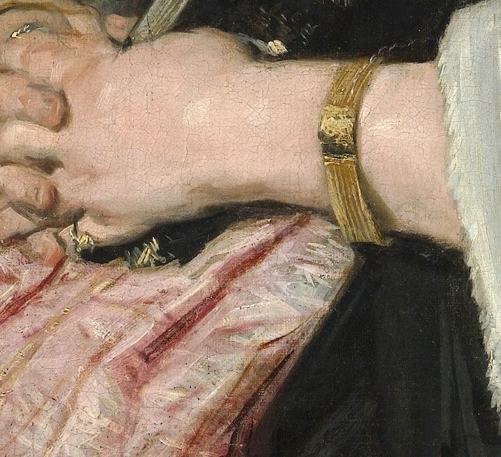 The gentle clasped hands convey a sense of quietude and inner reflection.