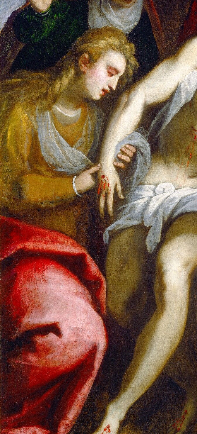 Scarlet drapery against white flesh is the painting's most arresting color collision; the physical embrace translates grief into bodily weight