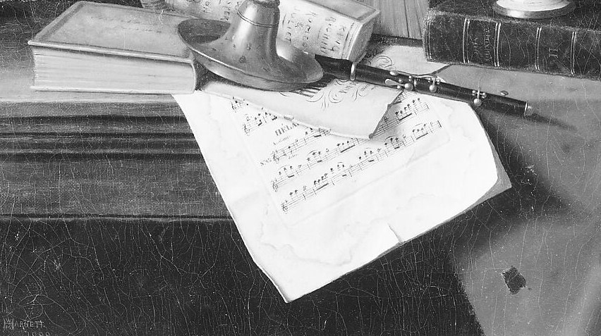 Books and music on a wooden ledge. Quiet, scholarly.