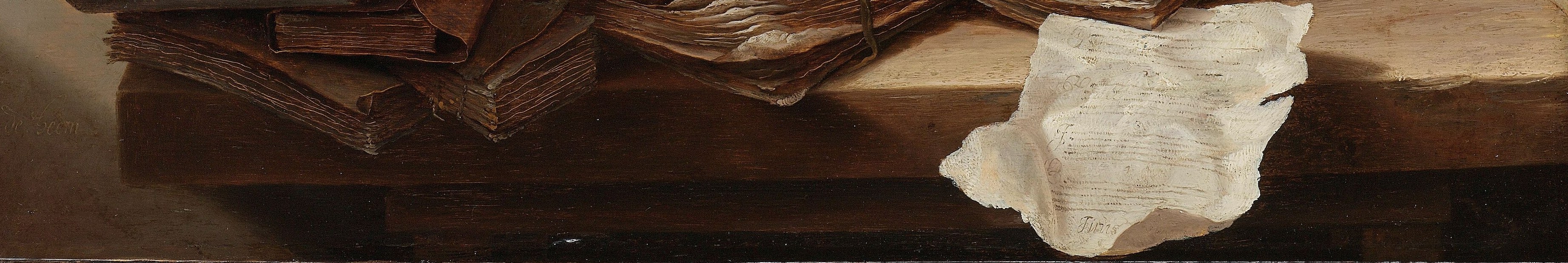 The smooth, reflective surface grounds the composition and highlights the textures of the objects placed upon it.