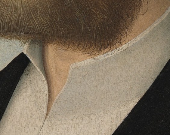 A bright accent between the sober black robe and warm skin; the fine pleating signals costly fabric and careful self-presentation beneath the austere exterior.