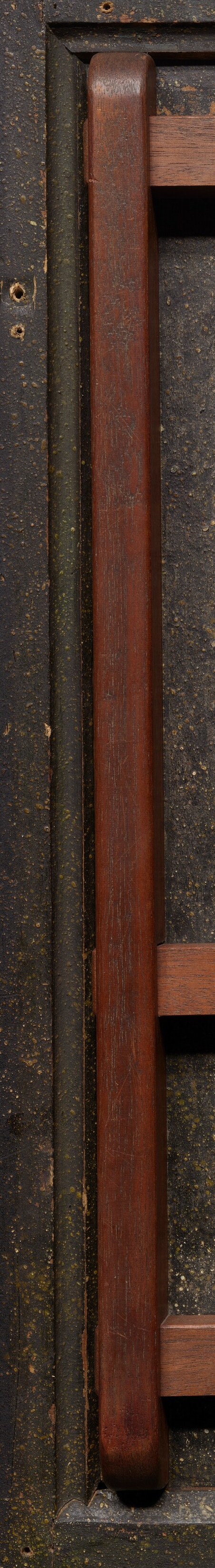 The wooden frame suggests this panel was handled often.