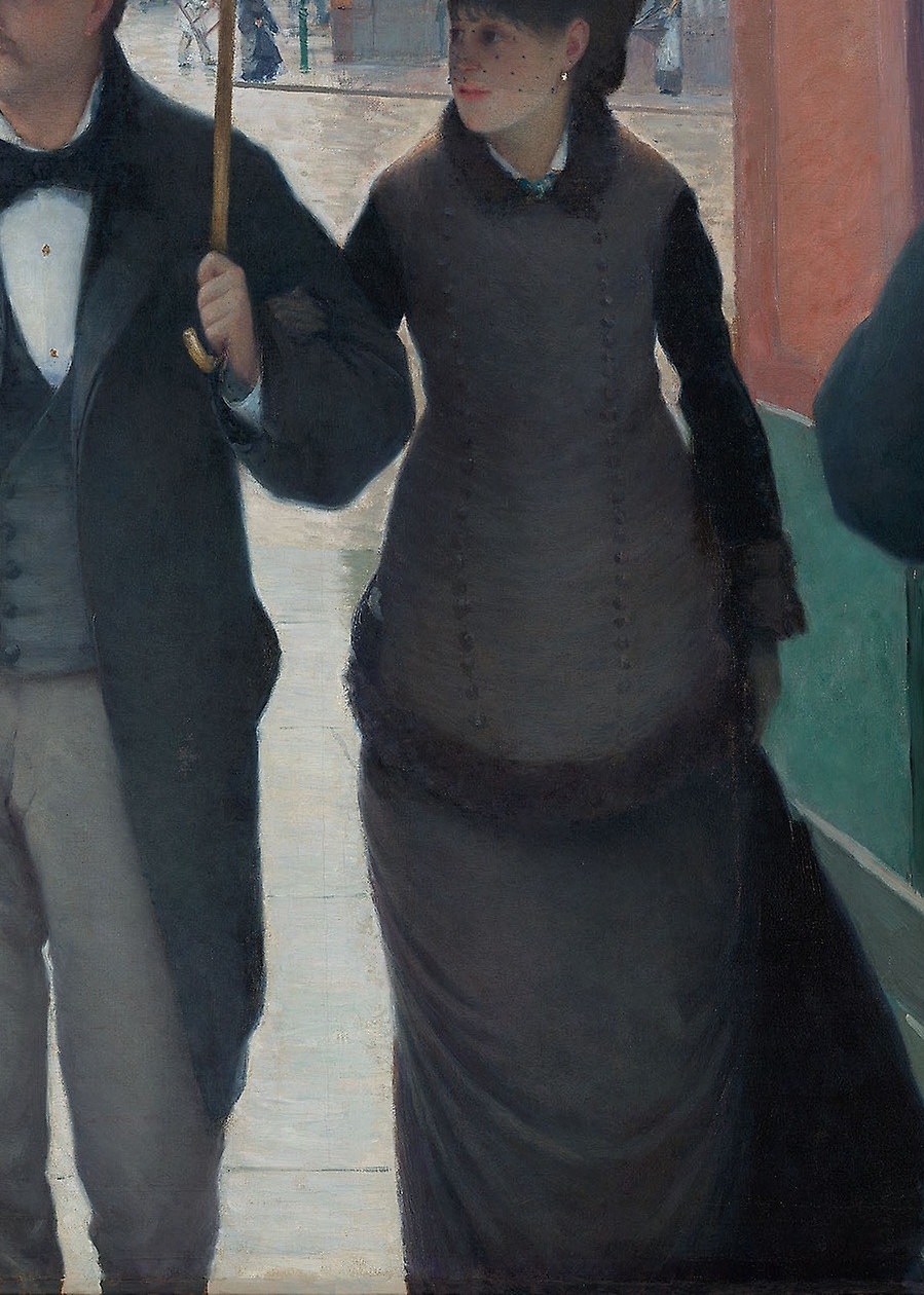 Her dress is dark and full of fabric.