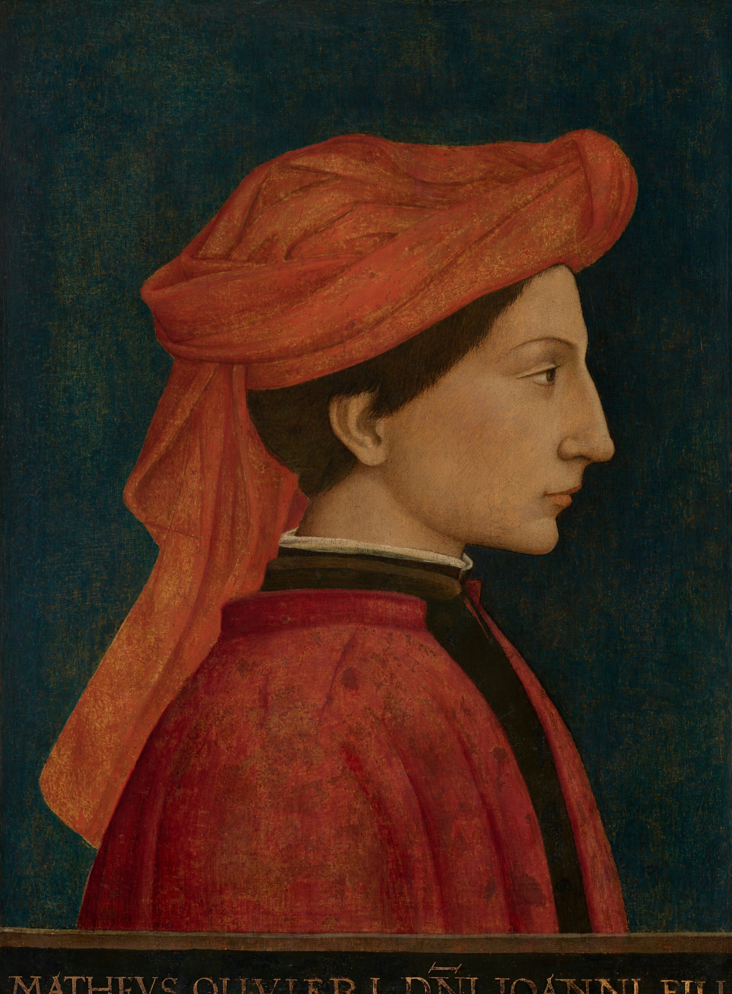 The deep, uniform background isolates the figure, emphasizing his presence and the richness of his attire.