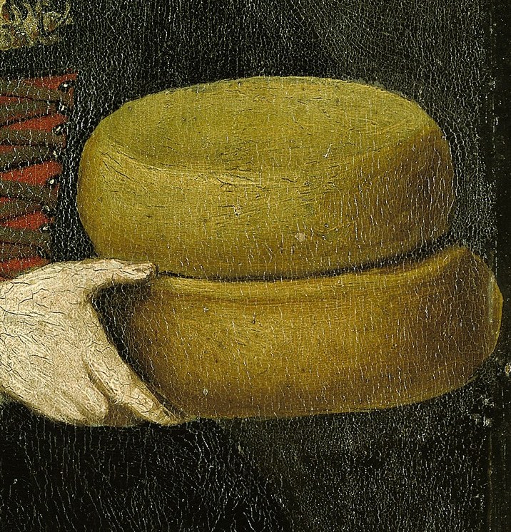 These objects are central to the painting's theme, representing local produce and the woman's livelihood.