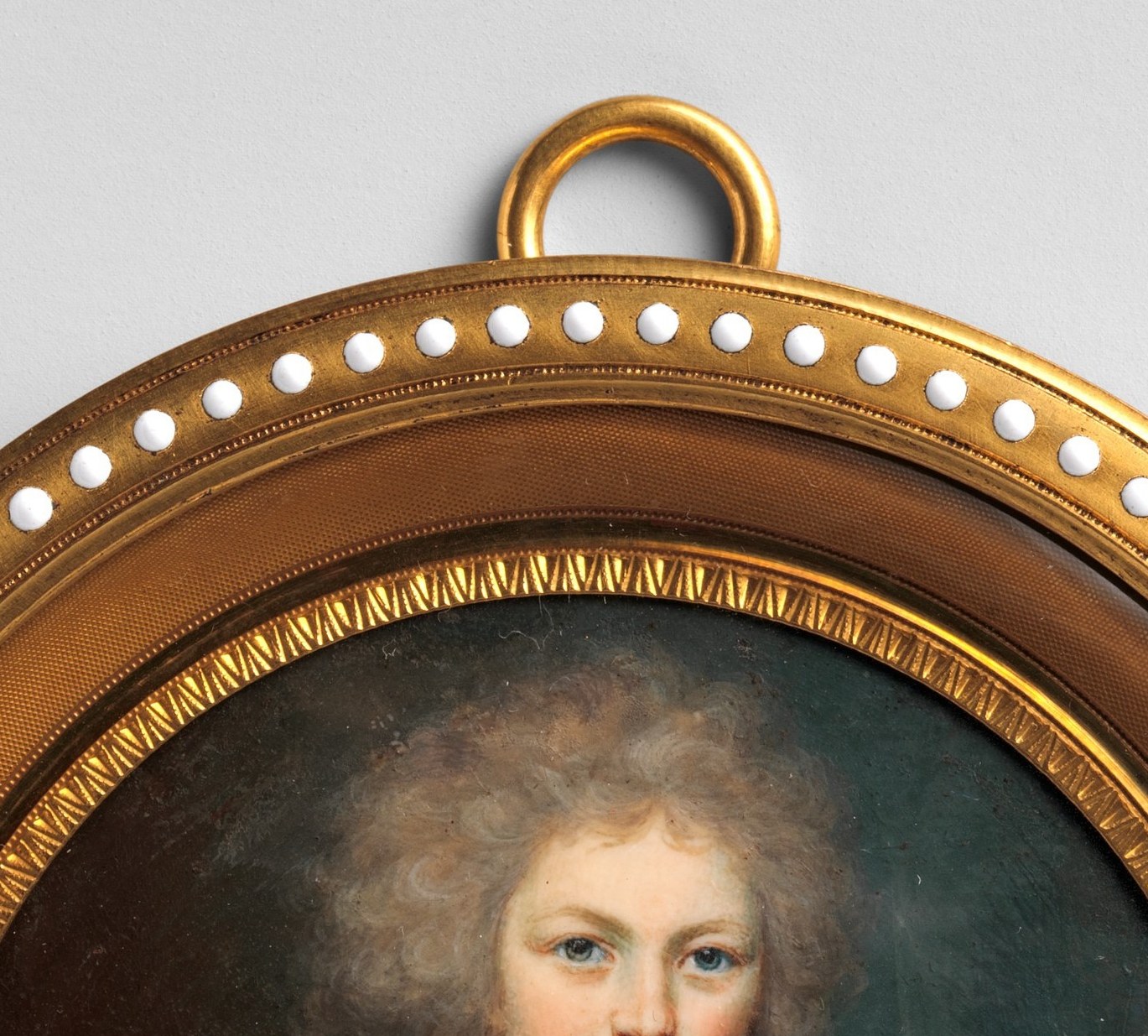 Her eyes engage the viewer head-on , the intimacy typical of miniature portraiture; a camera push-in would feel like eye contact across centuries.