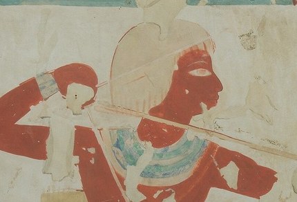 The archer's face is in profile. But his eye looks straight at us.