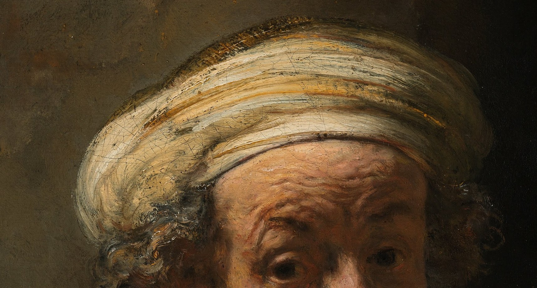 The turban suggests scholarly thought.