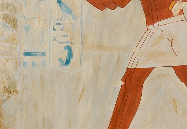 And in the background, faint hieroglyphs provide historical context.