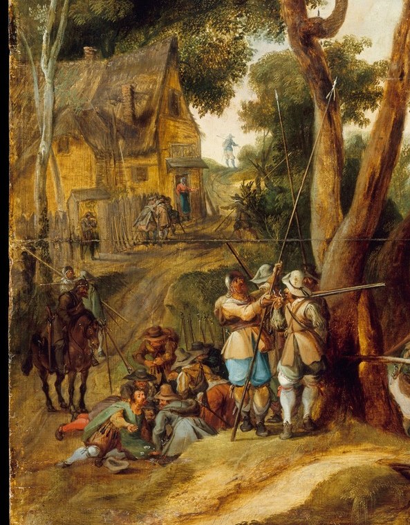 Under a bare tree, soldiers sit on the cold ground.