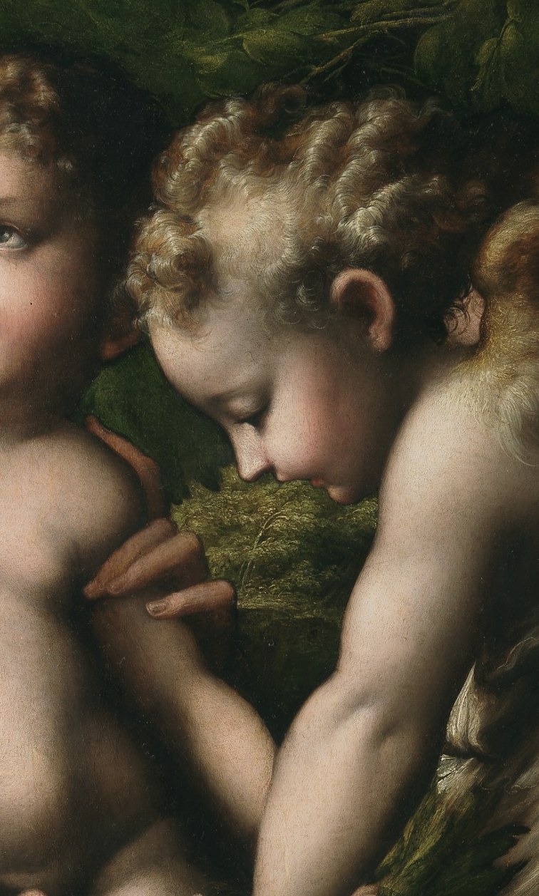 An angel offers the symbolic fruit.