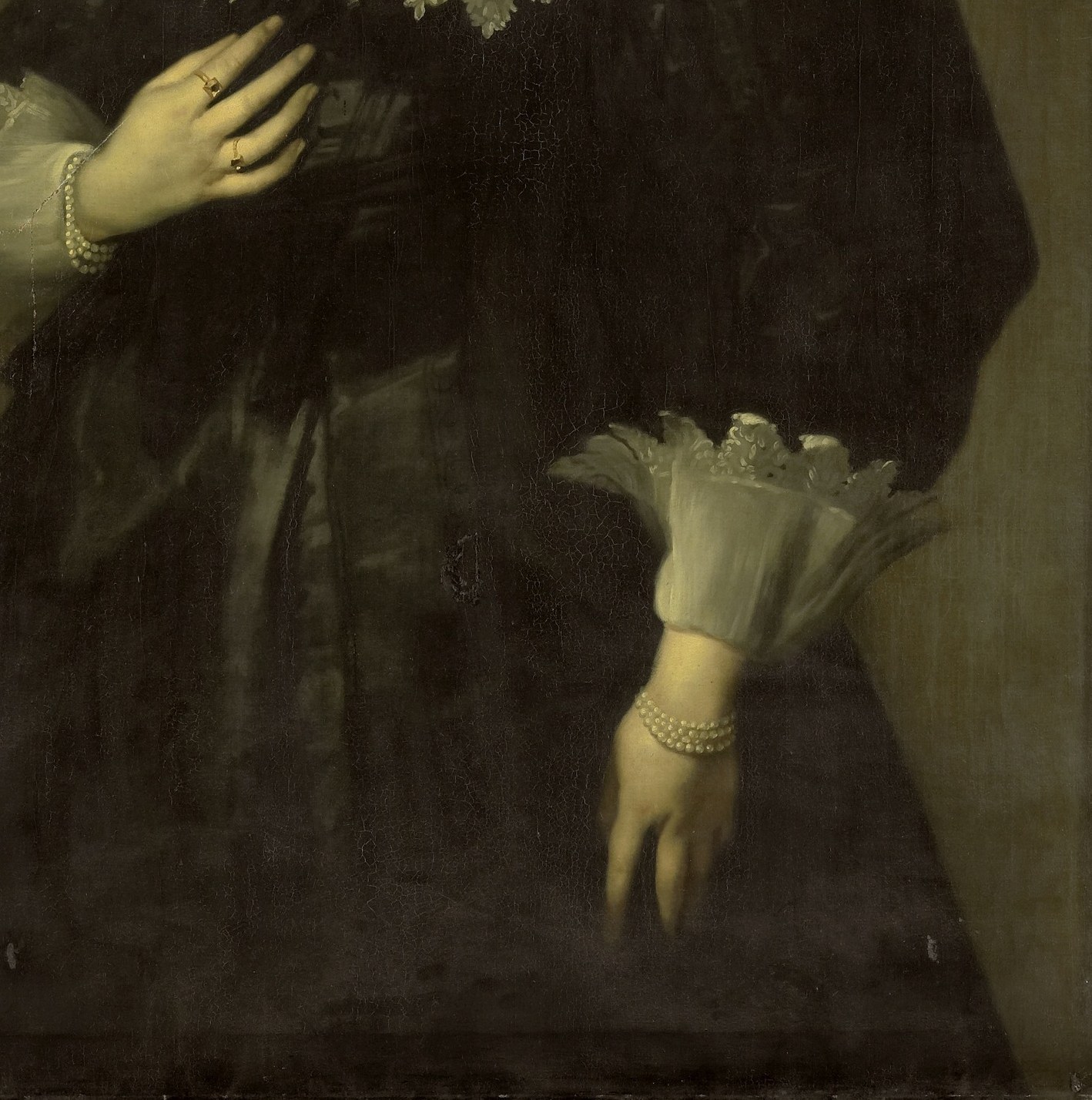 Her dark velvet dress adds to the opulent impression.