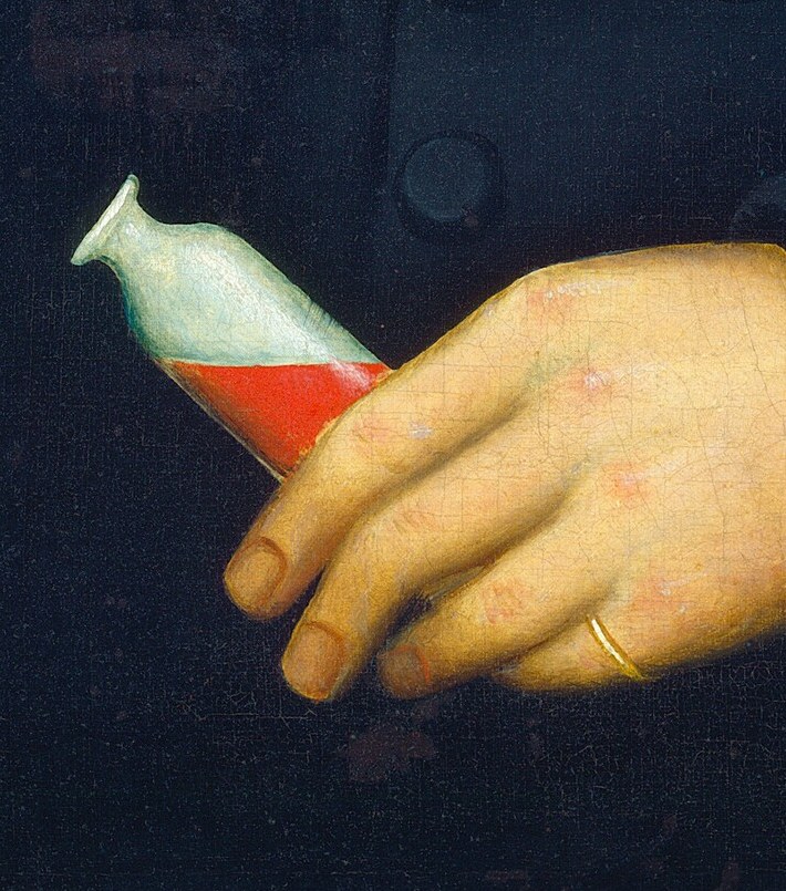 But look at what he holds in his right hand.