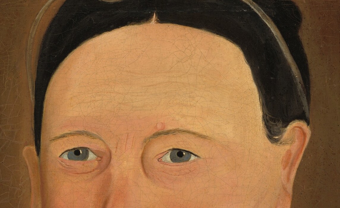 The simple, dark cap frames her face and suggests a modest, perhaps religious, disposition.