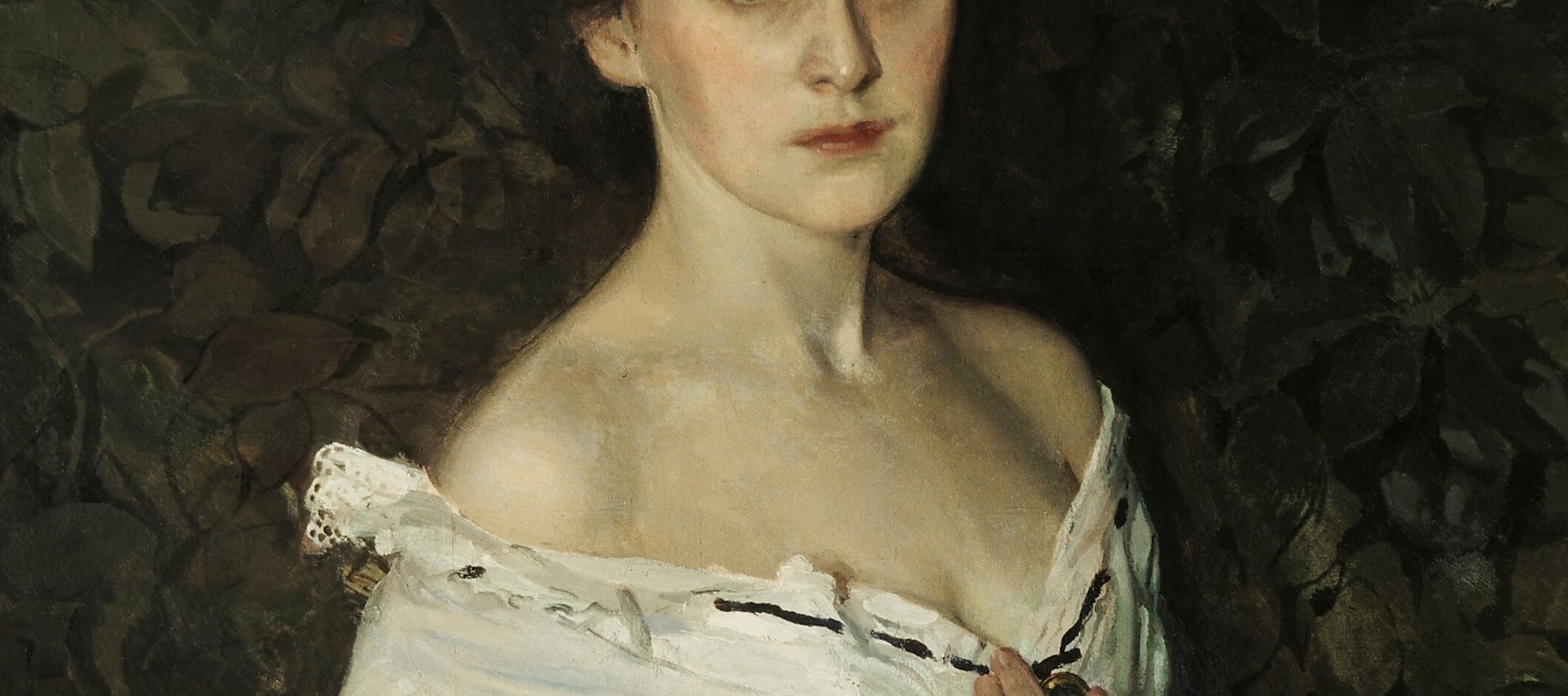 The pale exposed shoulders emerge from deep blue silk and white lace , the contrast anchors the painting's color drama and signals the subject's social class and period.