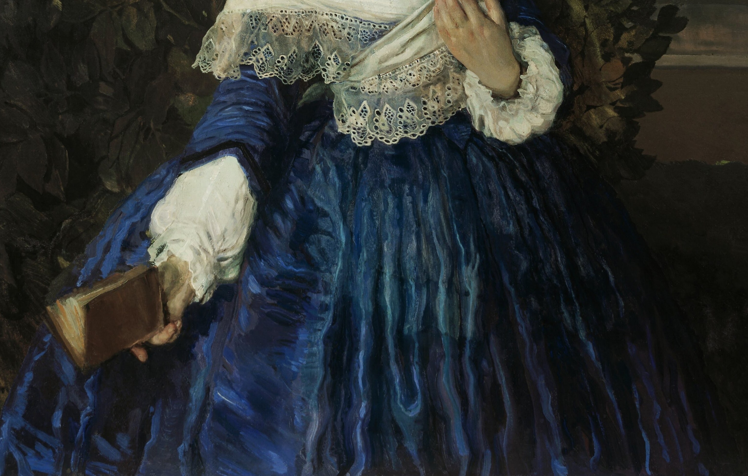 The deep blue skirt swallows the light.