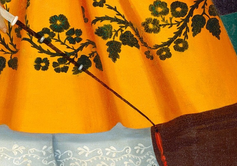 Notice the intricate black embroidery on the child's yellow dress.