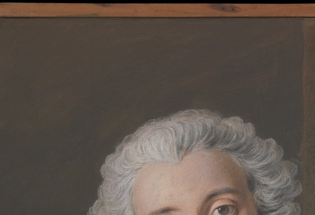 The formal wig against the warm background is a precise class marker; its bright mass pulls the eye to the left half of the composition