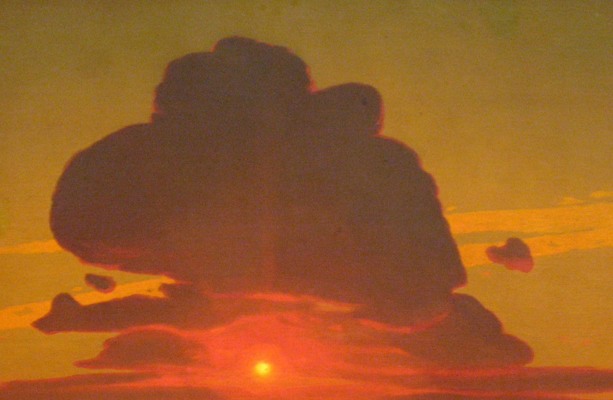 A monumental silhouetted cloud that compresses the sky and frames the sun below; its bruised purple-black underside contrasts violently with the orange fire beneath, driving the composition's drama.