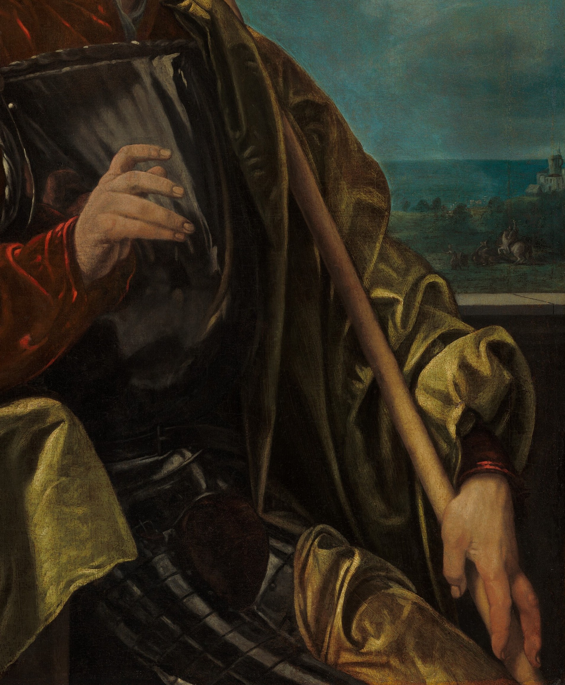 His gold cloak whispers of status and wealth.