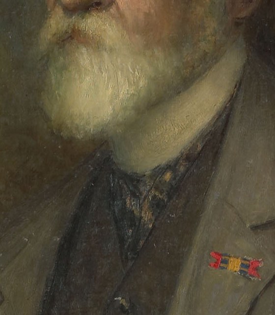 The full, white beard adds to his distinguished appearance and suggests a mature, established figure.