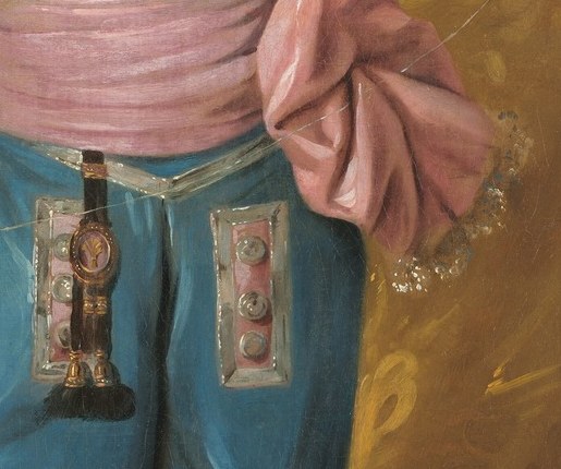 The soft folds and vibrant color add a touch of youthful exuberance and contrast with the blue suit.
