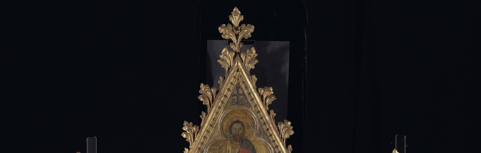 The frame IS architecture at miniature scale , echoing the cathedral-building fever of 1350 Florence; the triptych carries the city's skyline ambitions into the chapel.