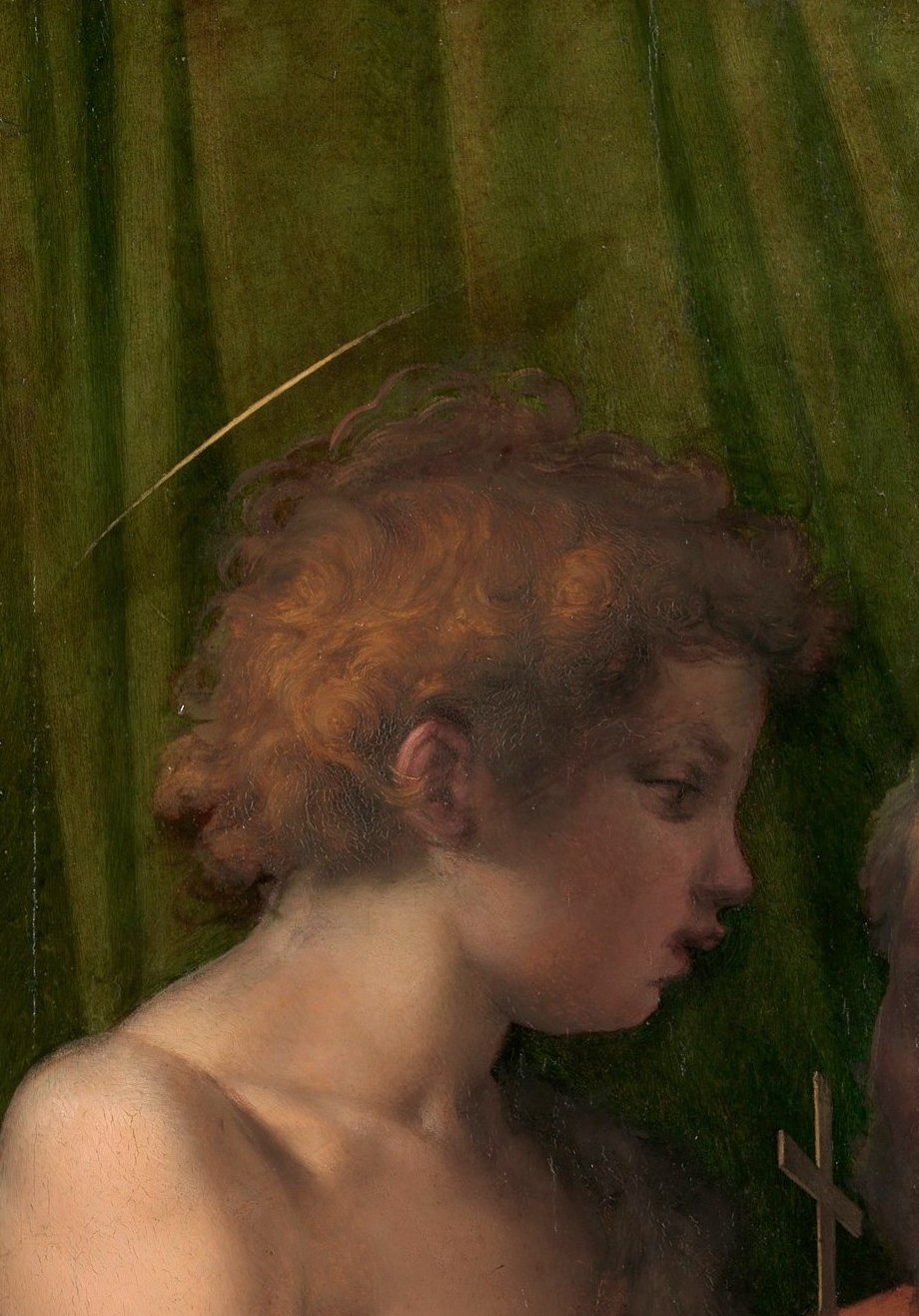 Florence's patron saint depicted as a peer of the Christ Child , his expression carries concentrated purpose, not childlike play, underscoring the political allegory of the commission.
