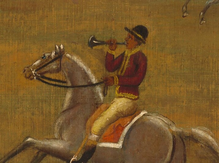 Look closely at the lead rider, raising his bugle.