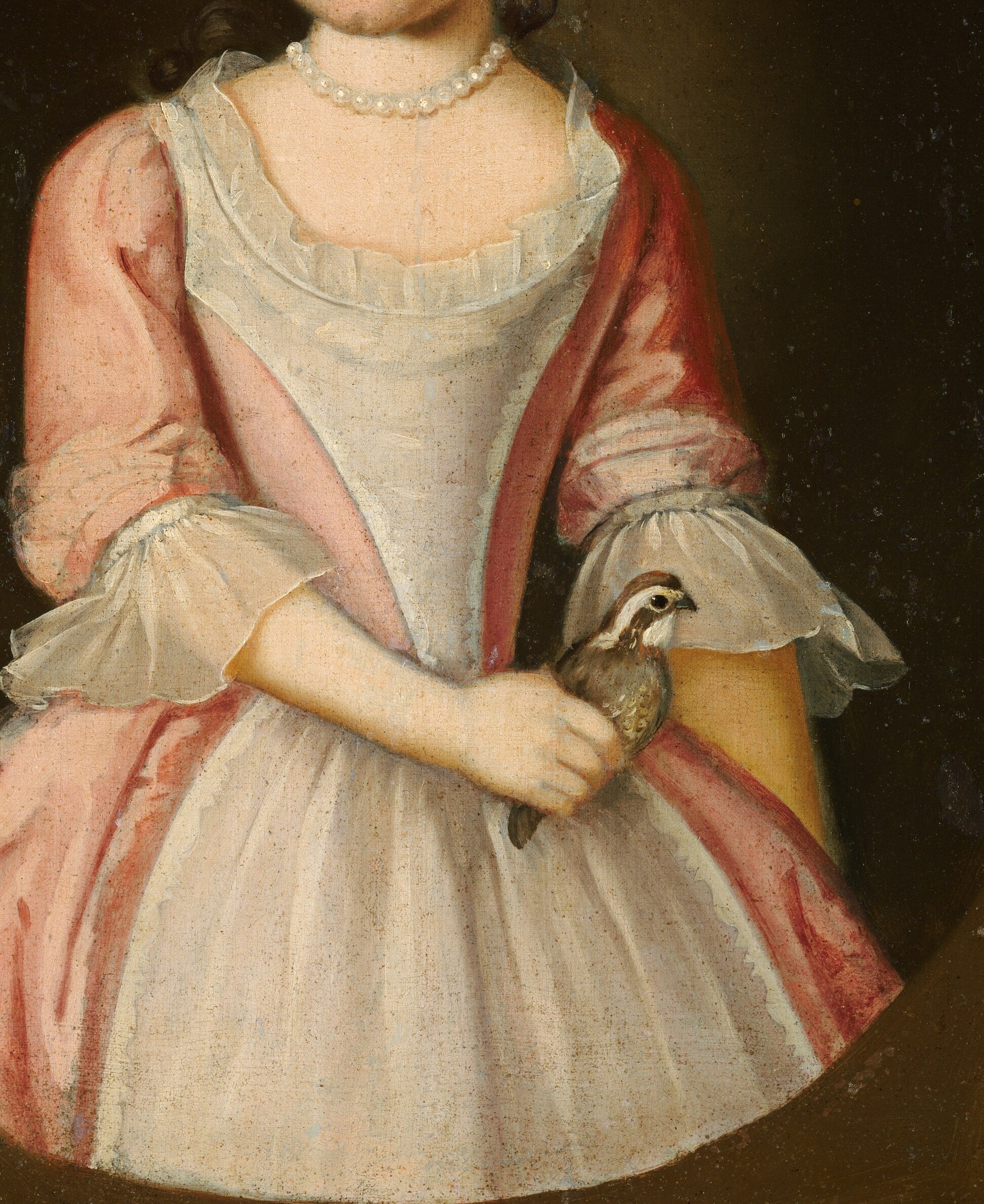 Look at the fine, ruffled fabric of her dress.