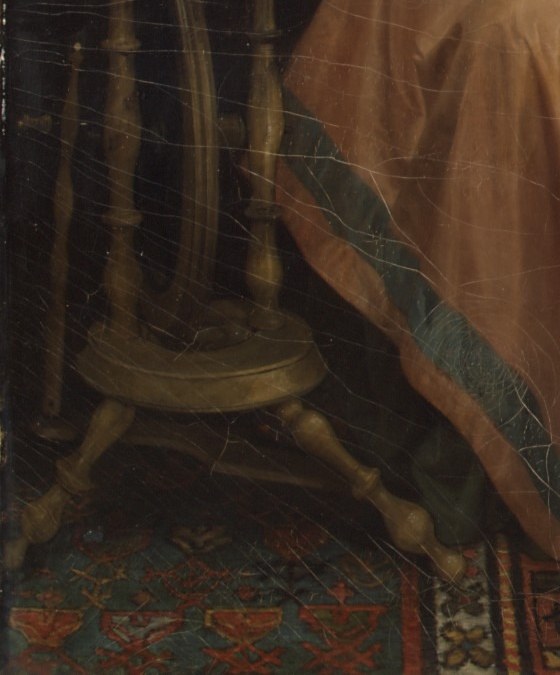 The spinning wheel has stopped. Her work is interrupted.