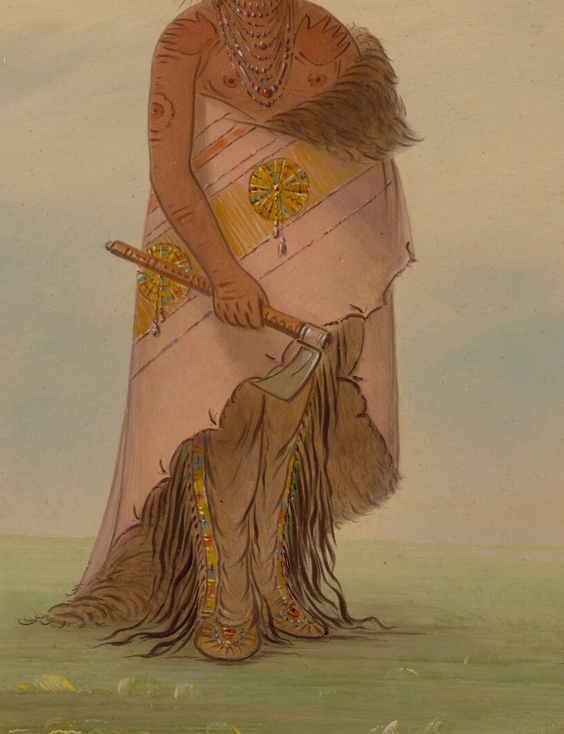 His patterned robe shows intricate cultural attire and craftsmanship.