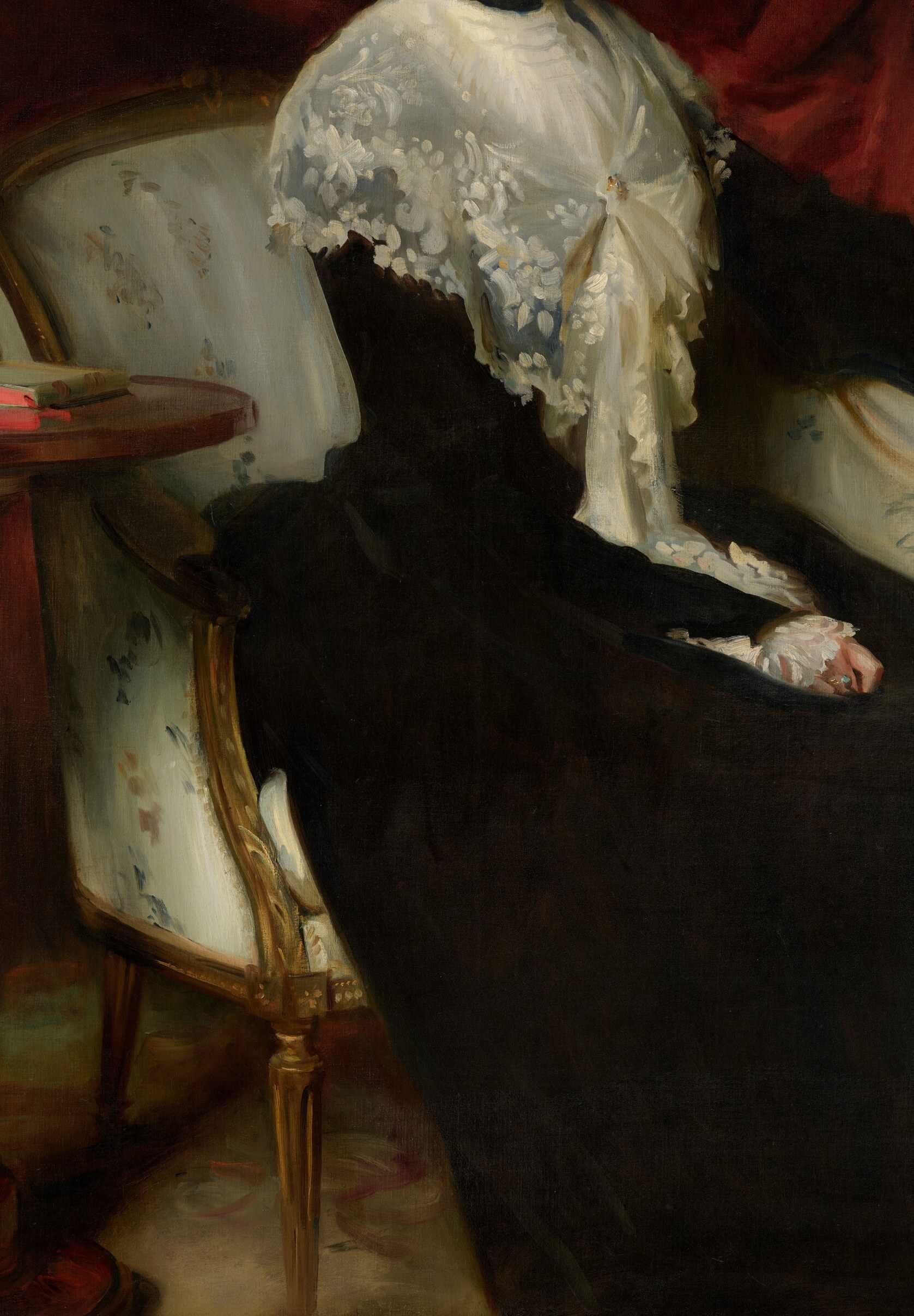 The black dress signals widowhood. But no mourning veil, no downcast eyes.