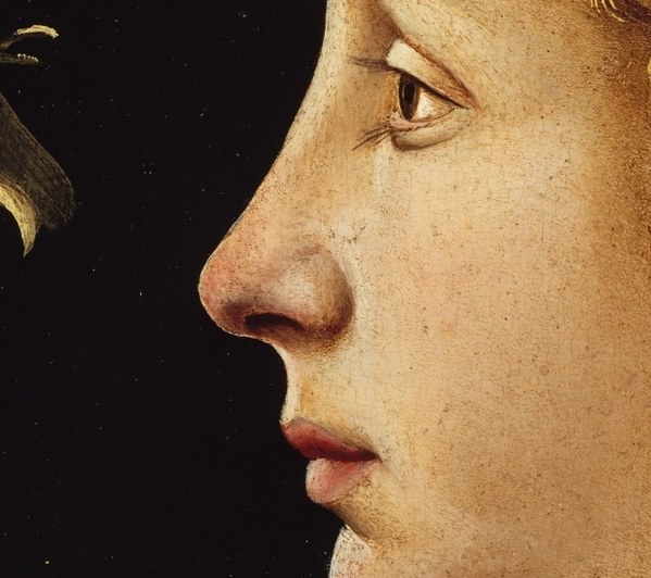 His lips are parted. He seems to be speaking, or breathing.
