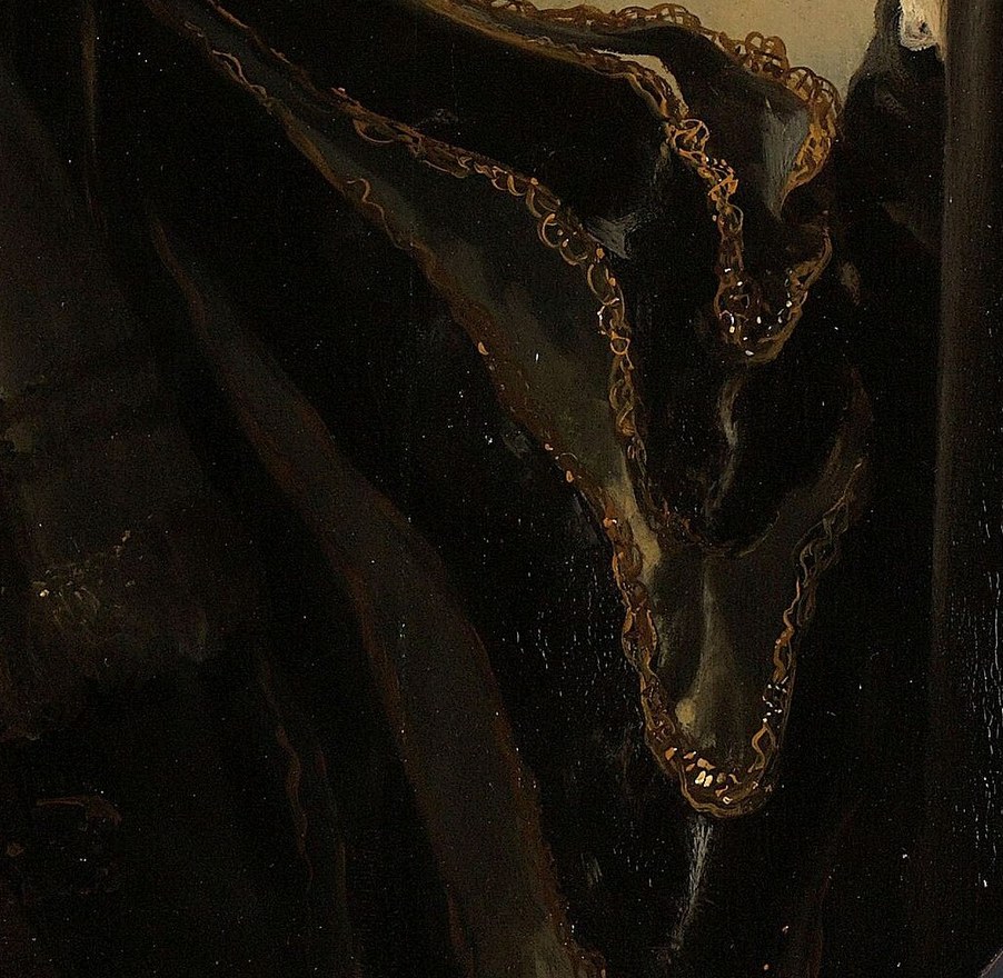 The gold embroidery highlights his status.