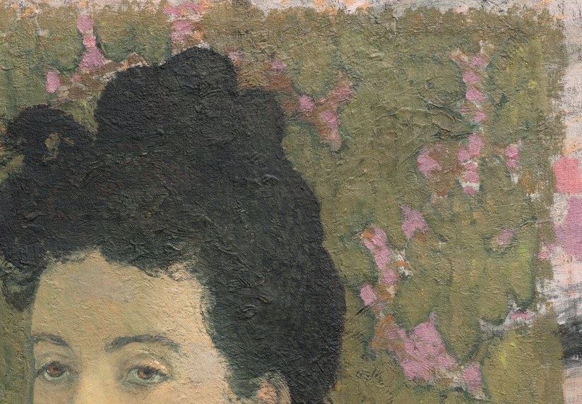 Subtle pink blossoms emerge from the painted surface.