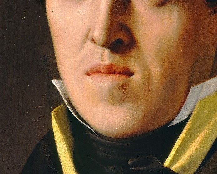 He carries his status quietly. Look at his mouth.