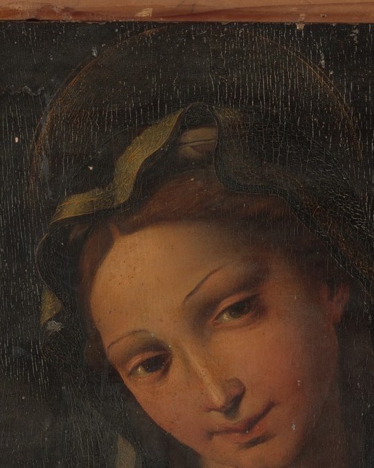 Serene downcast gaze of idealized maternal tenderness , the Renaissance face type that anchors the composition's entire emotional register