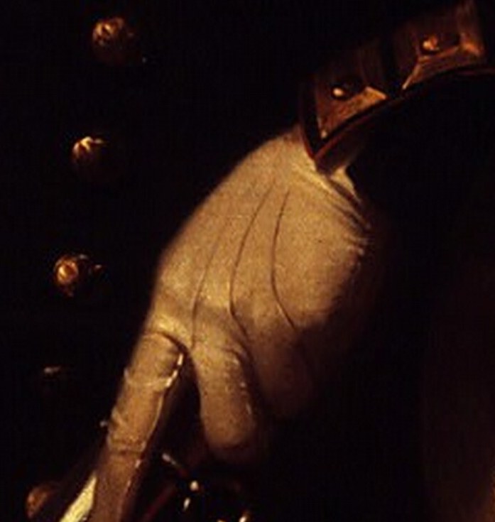 The white glove and the grip on the sword hilt suggest readiness and a formal pose.
